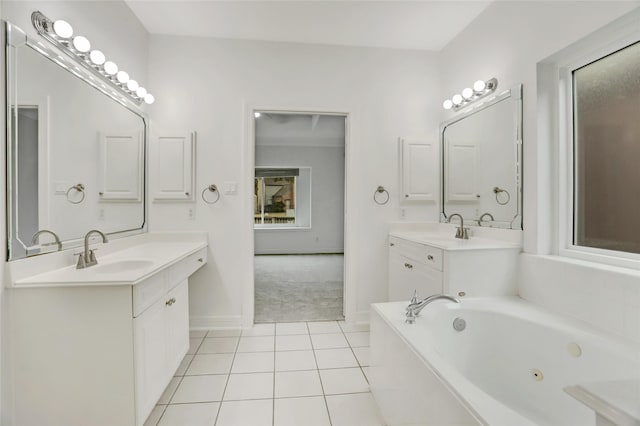 bathroom featuring vanity, tile patterned flooring, and a bathing tub