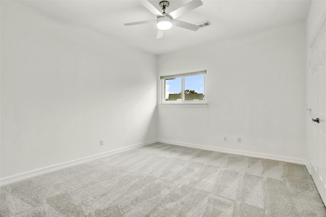 empty room with ceiling fan and carpet flooring