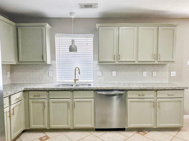 kitchen featuring light tile patterned floors, decorative backsplash, dishwasher, hanging light fixtures, and sink