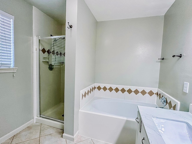 bathroom featuring vanity, tile patterned flooring, and independent shower and bath