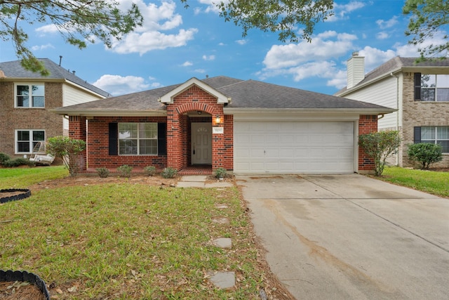 view of front facade featuring a front lawn and a garage