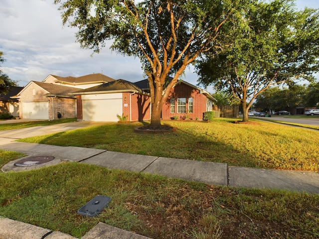 single story home featuring a front yard and a garage