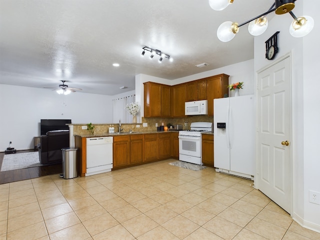 kitchen featuring white appliances, tasteful backsplash, sink, ceiling fan, and light tile patterned floors