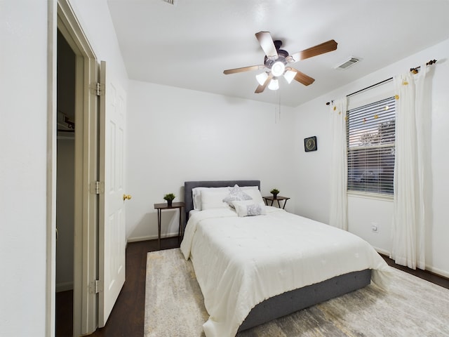 bedroom featuring ceiling fan and dark hardwood / wood-style flooring