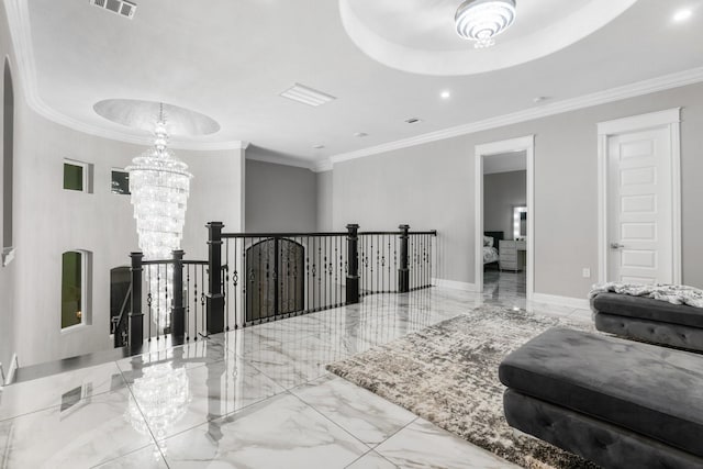 hall featuring a chandelier and crown molding