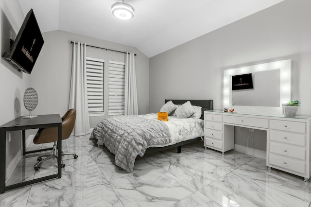 bedroom featuring lofted ceiling