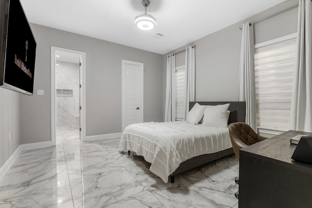 bedroom featuring ensuite bathroom