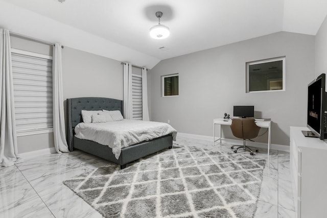 bedroom with lofted ceiling