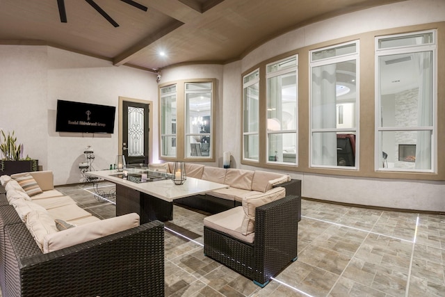 living room with ceiling fan, beamed ceiling, and wooden ceiling