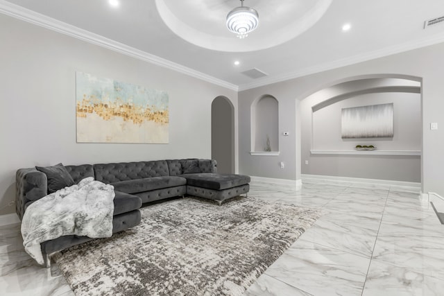 living room featuring a tray ceiling and crown molding