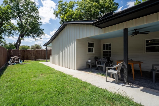 view of yard with ceiling fan and a patio area