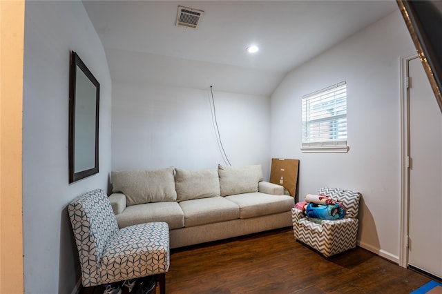 living area with lofted ceiling, visible vents, dark wood finished floors, and recessed lighting