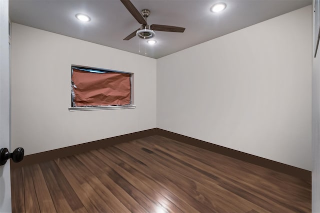 empty room with dark wood-type flooring, recessed lighting, ceiling fan, and baseboards