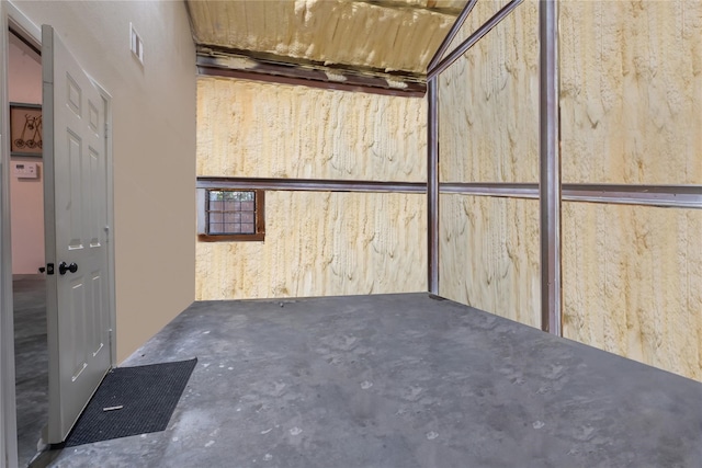 interior space with visible vents and unfinished concrete flooring