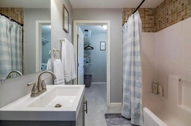 bathroom featuring vanity and baseboards