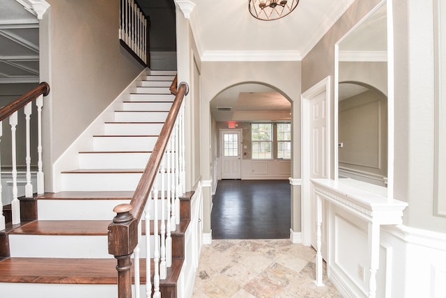 entrance foyer featuring crown molding