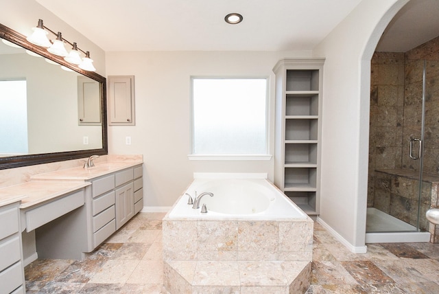 bathroom with separate shower and tub and vanity