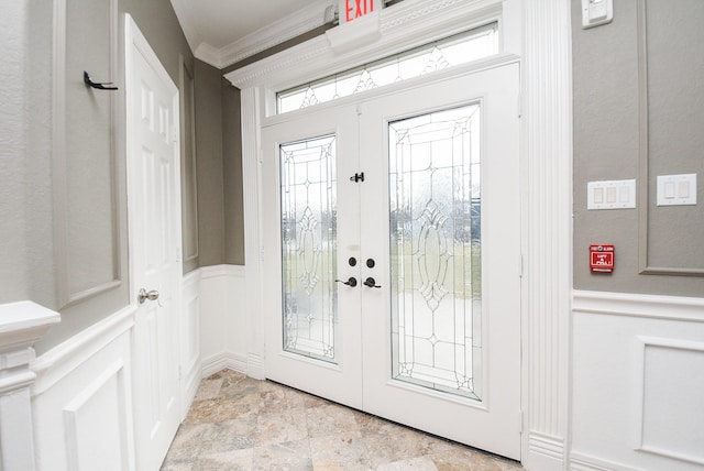 doorway featuring ornamental molding and french doors