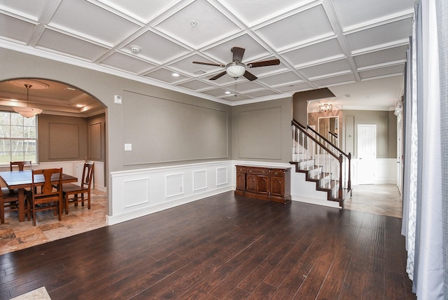 living room with hardwood / wood-style flooring, ceiling fan, crown molding, and coffered ceiling