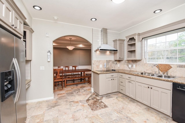 kitchen featuring decorative backsplash, pendant lighting, ornamental molding, wall chimney exhaust hood, and black appliances