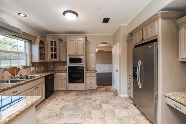 kitchen featuring backsplash, black appliances, sink, crown molding, and light brown cabinetry