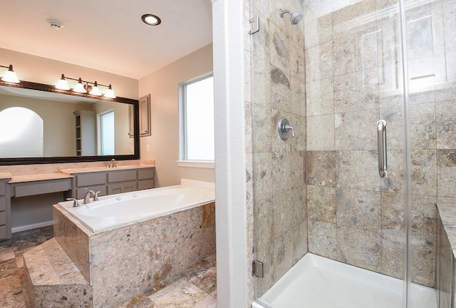 bathroom featuring separate shower and tub and vanity