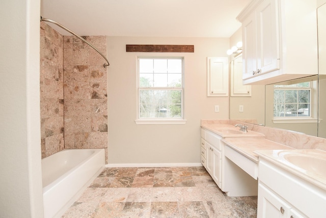 bathroom with vanity and  shower combination