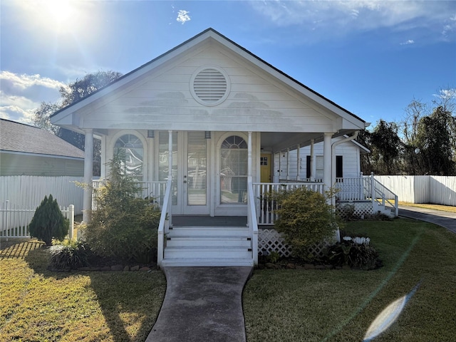 bungalow-style house with a front yard and a porch