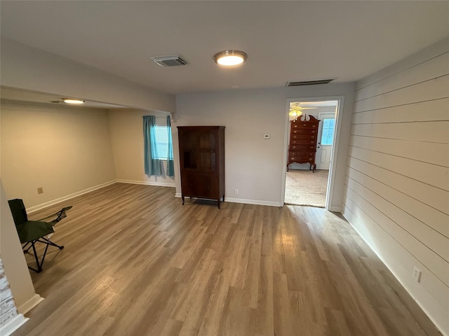 empty room featuring ceiling fan and hardwood / wood-style flooring