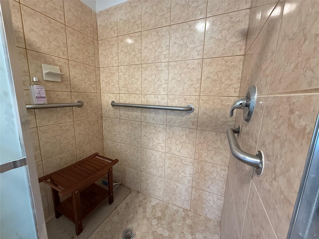 bathroom featuring a shower with door