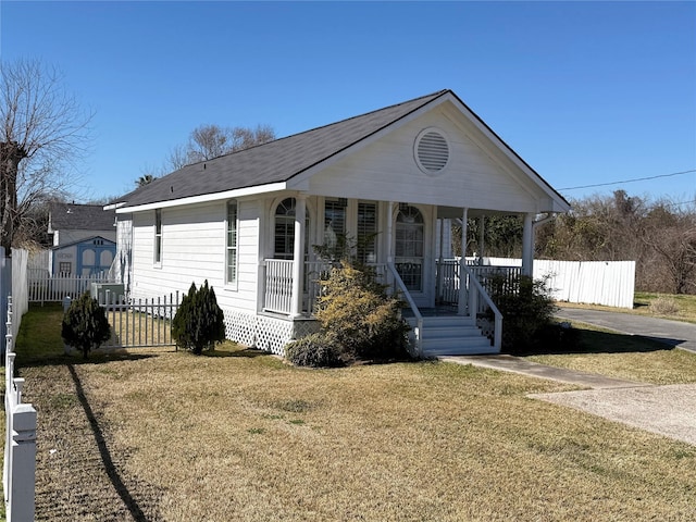 view of front of home with a porch and a front yard