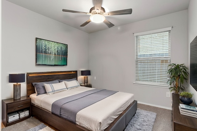 bedroom with ceiling fan and carpet flooring