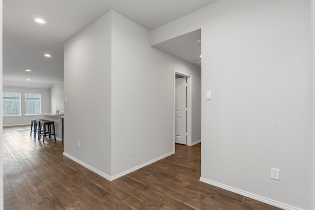 hall with dark wood-type flooring