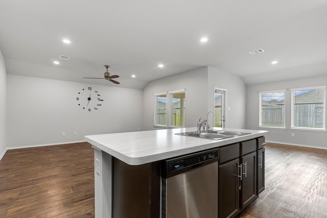 kitchen with vaulted ceiling, dishwasher, sink, and a center island with sink