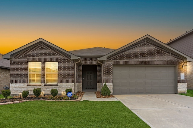 view of front of house with a lawn and a garage