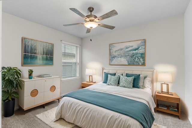 bedroom featuring ceiling fan and light carpet