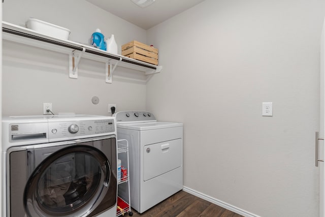 laundry area featuring separate washer and dryer and dark hardwood / wood-style floors