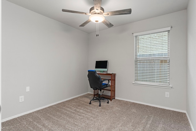 carpeted home office with ceiling fan