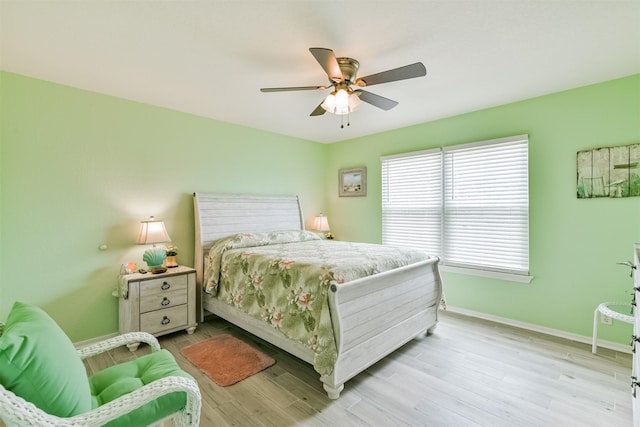 bedroom featuring ceiling fan and light hardwood / wood-style flooring