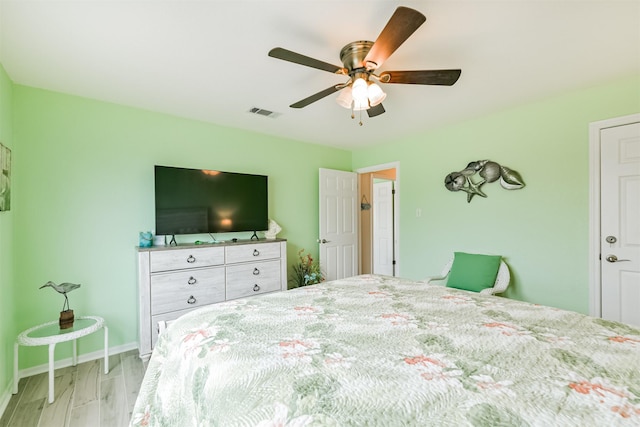 bedroom with ceiling fan and light wood-type flooring