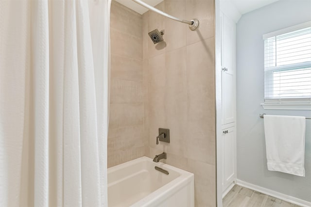 bathroom featuring shower / tub combo and wood-type flooring