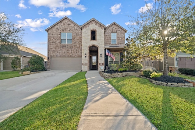 view of front of property with a garage and a front lawn