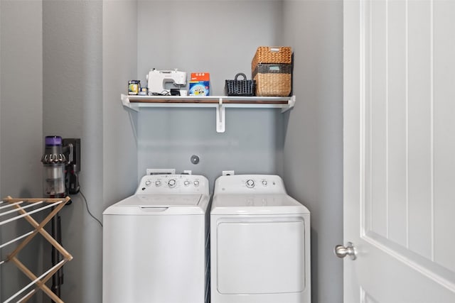 clothes washing area with independent washer and dryer