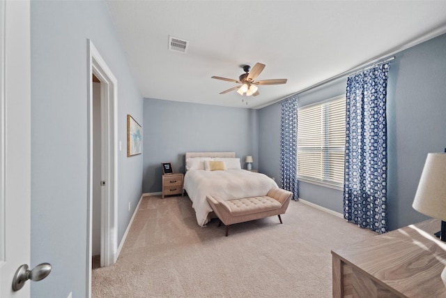 bedroom with ceiling fan and light colored carpet