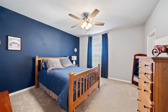 bedroom with light carpet and ceiling fan