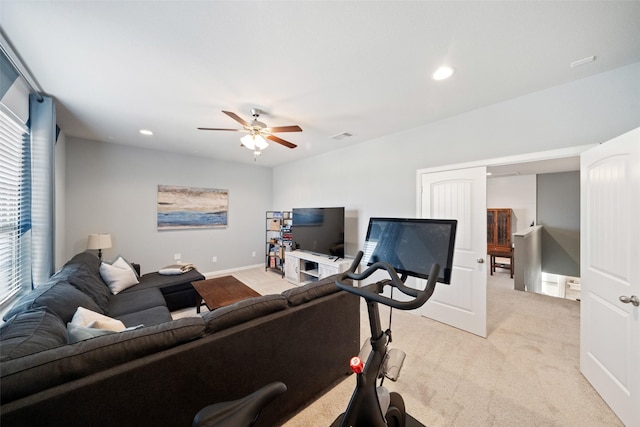 workout area with light carpet and ceiling fan