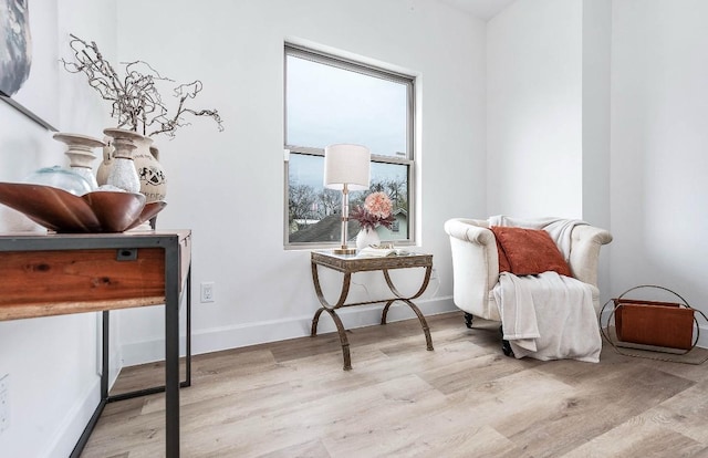 sitting room with light hardwood / wood-style flooring