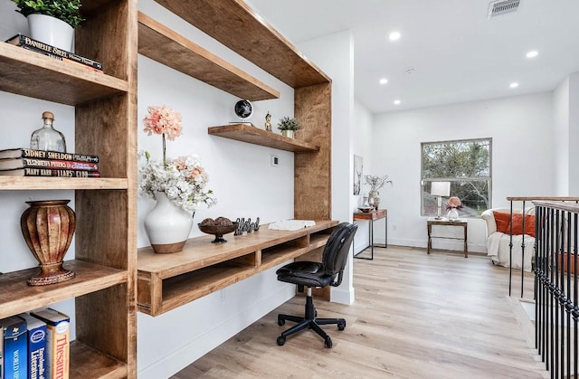 office with light hardwood / wood-style flooring