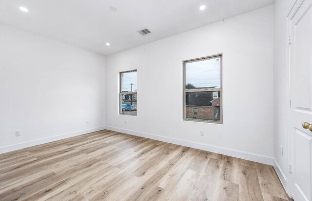 empty room with light wood-type flooring