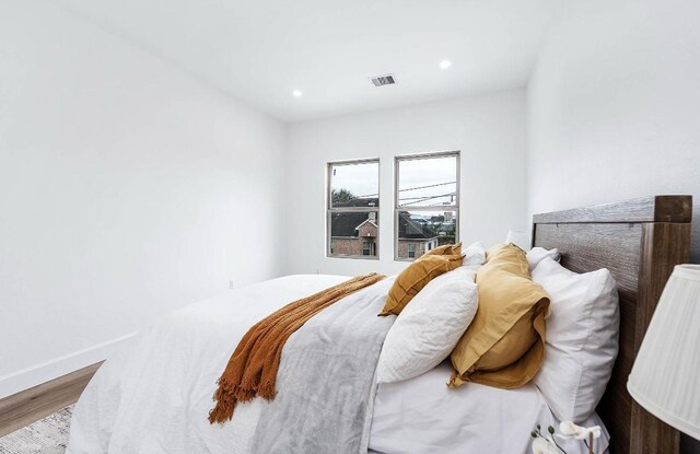 bedroom with wood-type flooring